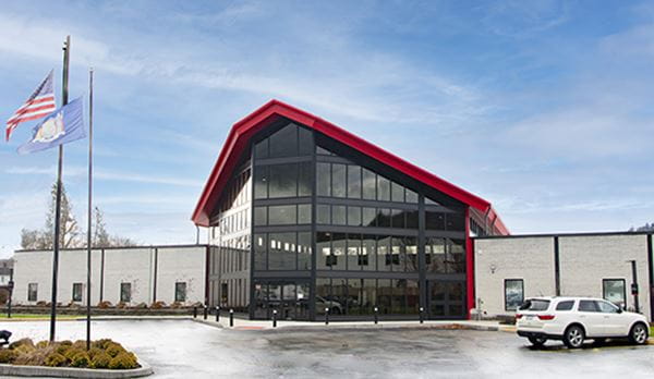 Greene, The Raymond Corporation Main Entrance, Large Red Arch with Windows
